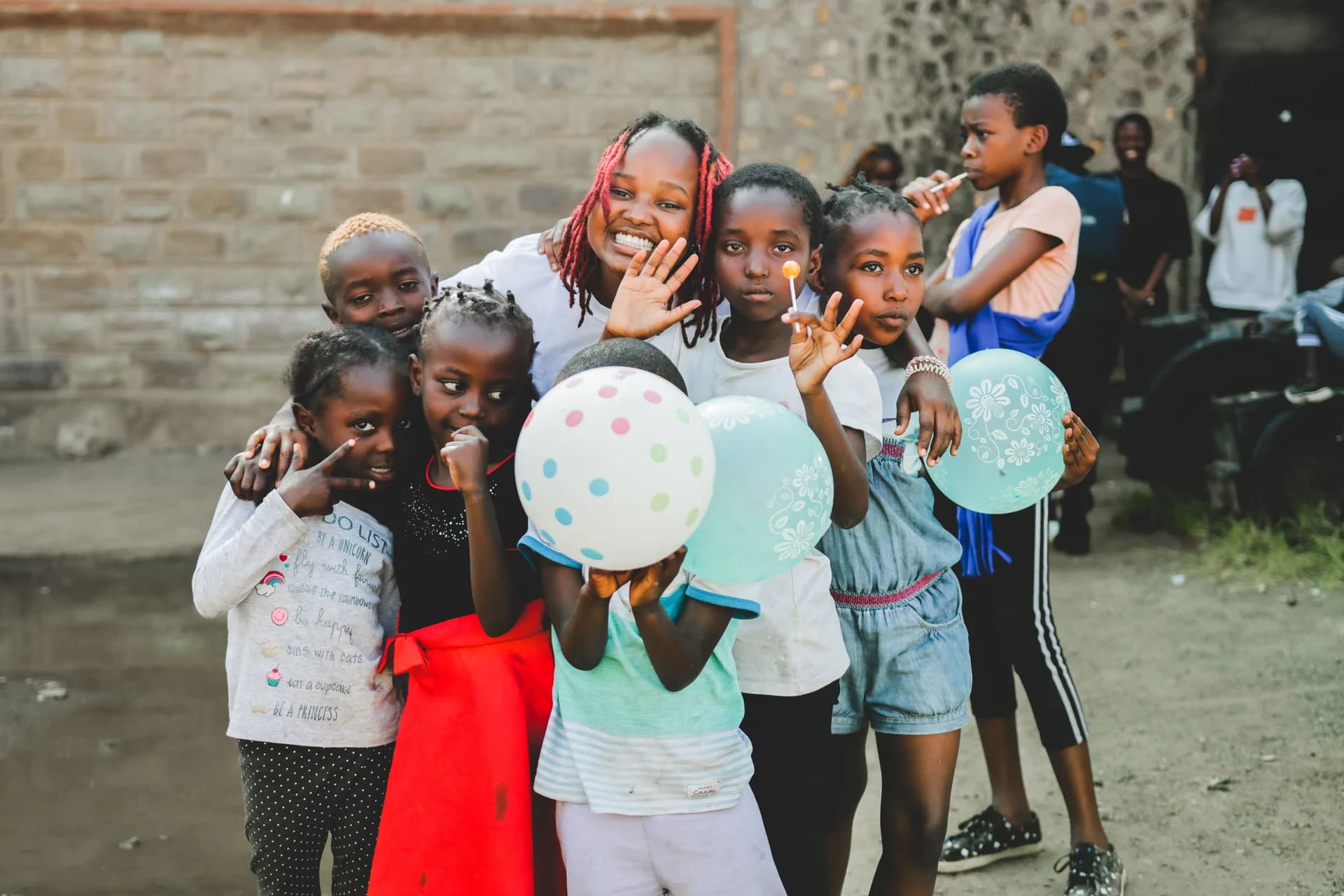 Children and volunteers at a Furaha community visit