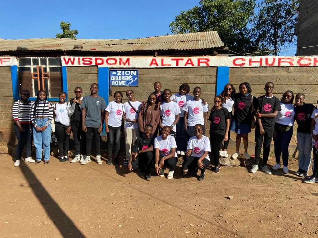 Furaha members gathering outside the community venue